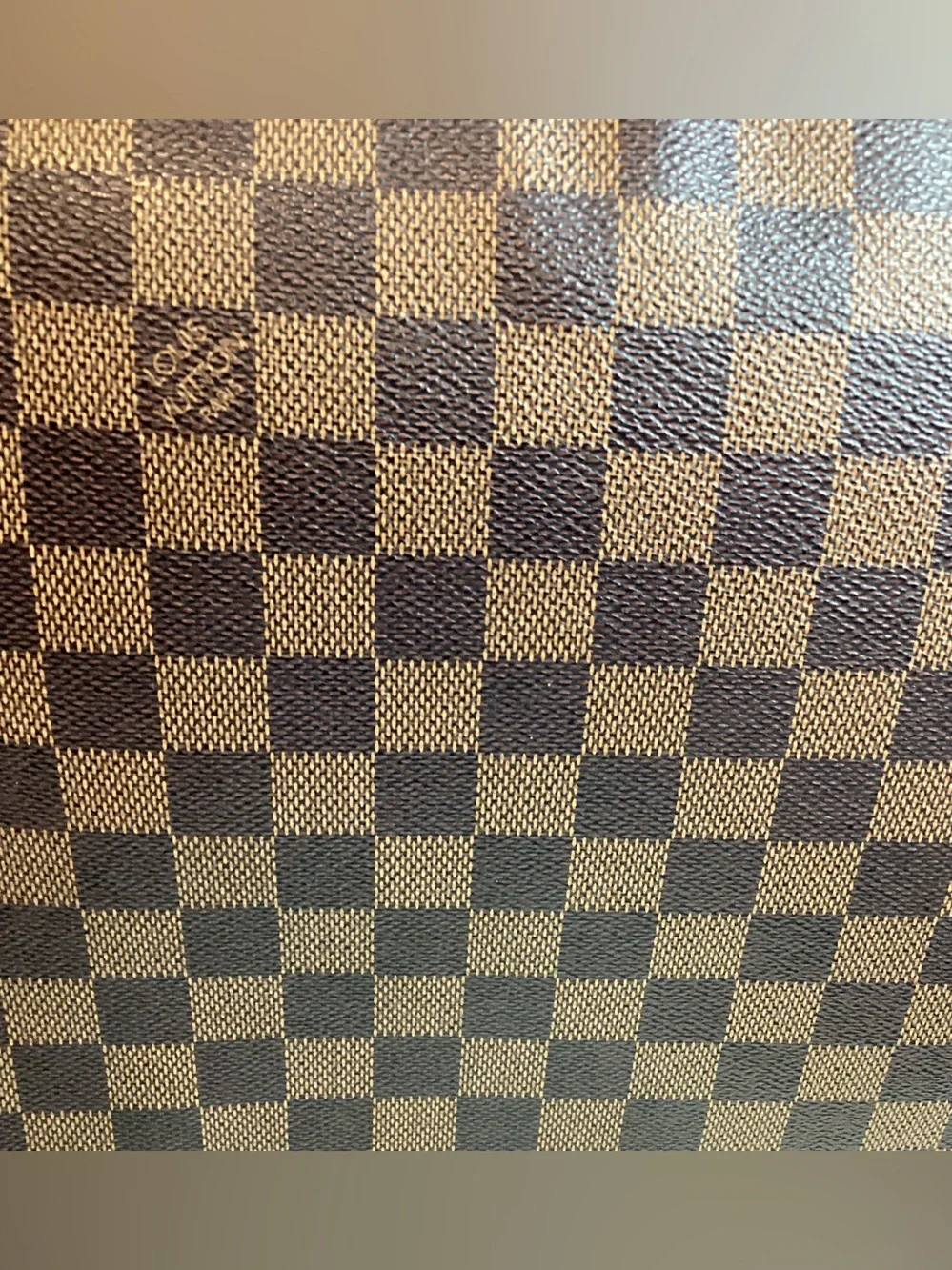 Louis Vuitton Damier Ebene District MM messenger bag.